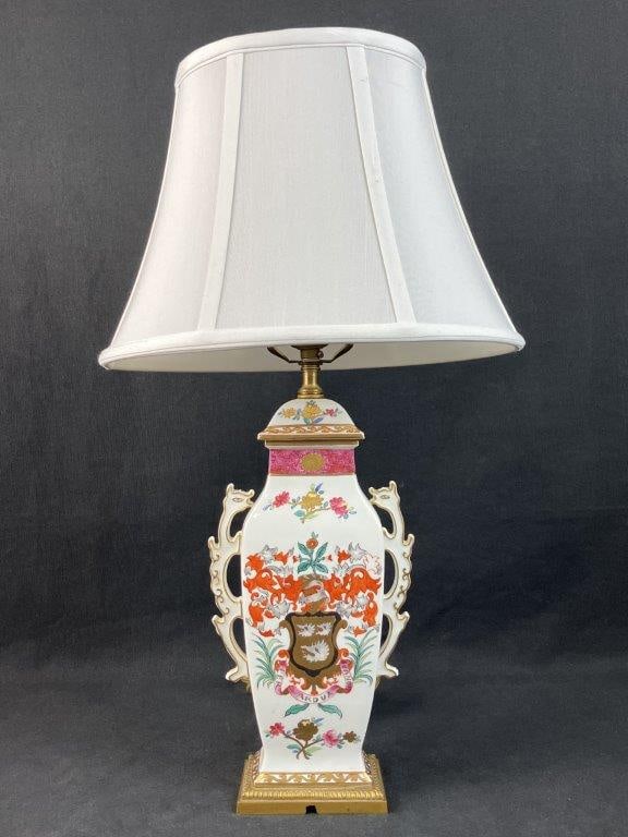 Porcelain de Paris Hand-Painted Armorial Lamp: This elegant Parisian porcelain lamp has been beautifully converted from a classic Porcelain de Paris urn. The sophisticated design features detailed hand-painting centered by an armorial crest with