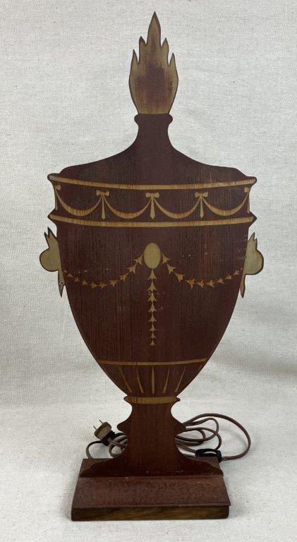 Neoclassical Style Metal Urn Lamp: Elegant table lamp features a unique metal cut-out silhouette, beautifully polychromed and finished to artfully resemble a classical urn. Embracing the timeless symmetry of the Neoclassical