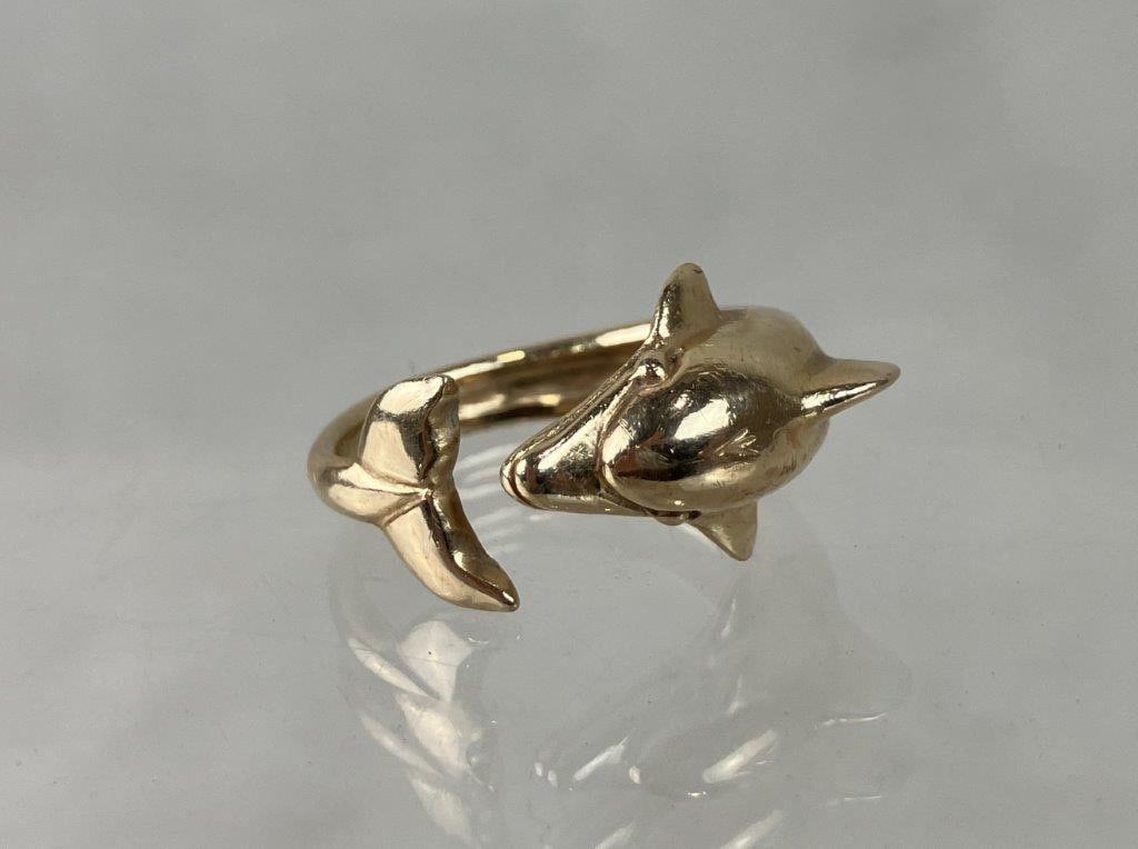 14 KT Gold Dolphin Ring: Elegant ring is beautifully crafted in 14-karat gold, masterfully sculpted into the fluid, graceful form of an encircling dolphin that wraps elegantly around the finger. Combining a playful marine