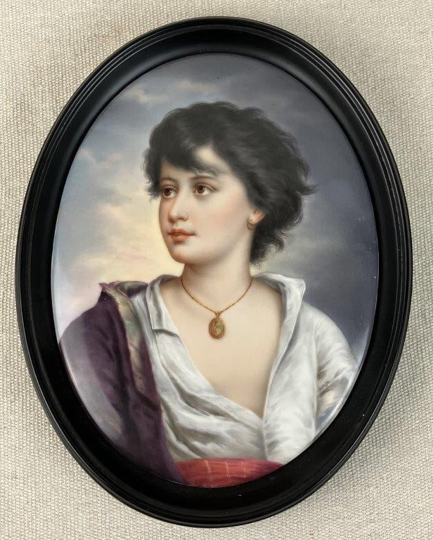 19th Century Hand-Painted Porcelain Portrait Plaque: Exquisite 19th-century hand-painted porcelain plaque depicts a young, engaging lady captured with free-flowing hair and an enchanting expression of wonderment. The portrait showcases masterful,