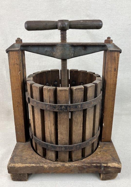 Country Wine Press: Exceptional antique country wine press features a robust cast iron frame beautifully contrasted by warm pine wood elements, capturing the true essence of old-world agrarian craftsmanship. Measuring