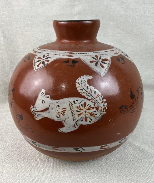 Mexican Painted Terracotta Vase: Mexican pottery vase is expertly crafted utilizing a traditional hand-coiled method from a rich red clay body, showcasing an array of warm red-brown tones and a finely burnished surface. The vessel