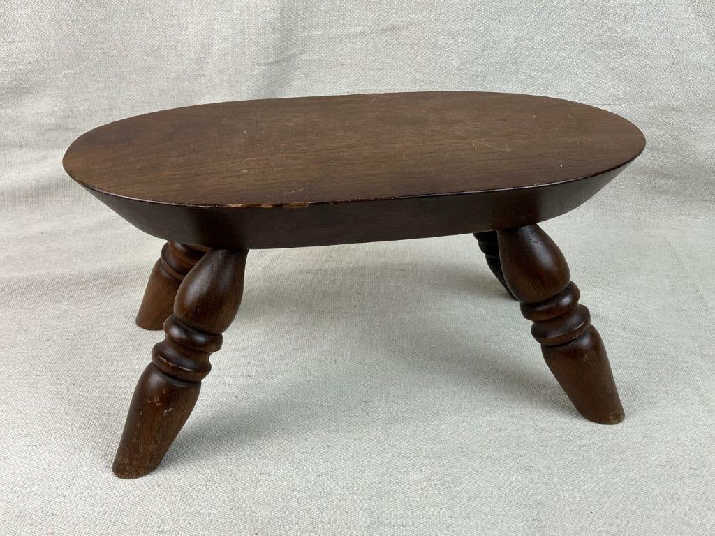 Walnut Footstool: This classic walnut footstool features a handsome oblong top supported by sturdy turned legs, showcasing a timeless silhouette and solid wood craftsmanship. The rich, warm grain of the walnut