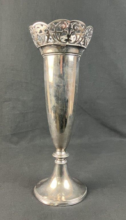Silverplate Trumpet Vase: Elegant silver plated trumpet vase showcases the refined craftsmanship and classic styling associated with the renowned Wallace Brothers Silver Company. Defining its sophisticated silhouette is a