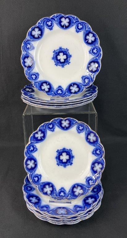 Johnson Brothers Savoy Flow Blue Plates: Eleven-piece collection of English earthenware showcases the breathtaking "Savoy" pattern by the legendary Johnson Brothers of Staffordshire, England. Each plate features a dramatic, Gothic-style