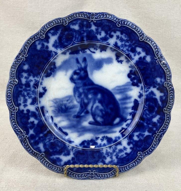 Ridgways Flow Blue Rabbit Plate: English earthenware plate showcases a classic example of historic flow blue transferware, featuring a whimsical central rabbit motif rendered in a rich, vibrant cobalt blue. Produced by the renowned R
