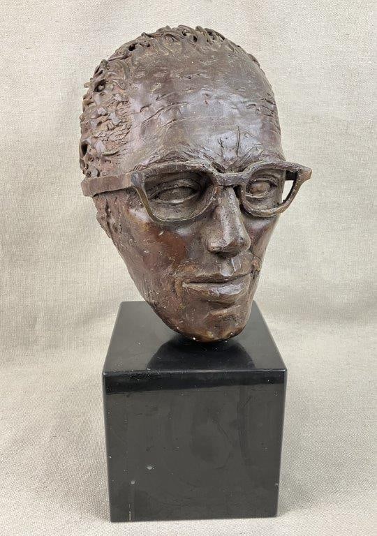 Modernist Cast Bronze Bust of a Man: Striking cast bronze bust features a sophisticated portrait of a man wearing glasses, defined by careful, naturalistic sculptural qualities that capture lifelike details and subtle character with