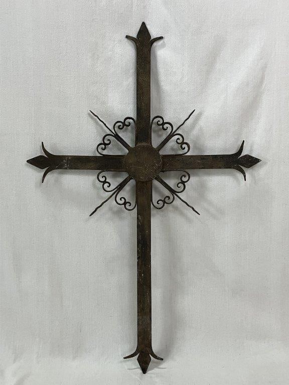 Folk Art Wrought Iron Cross: This hand-forged wrought iron cross features a central halo medallion framed by intricate scrollwork and classic fleur-de-lis tips. A beautifully weathered patina gives the piece an old-world feel, ma