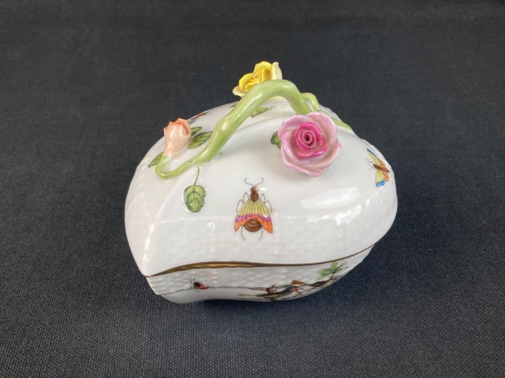Herend Hand-Painted Porcelain Covered Box: This hand-painted porcelain covered box from the notable Hungarian maker Herend features delicate hand-painted insect details alongside a vibrant applied flower decoration. The piece is further