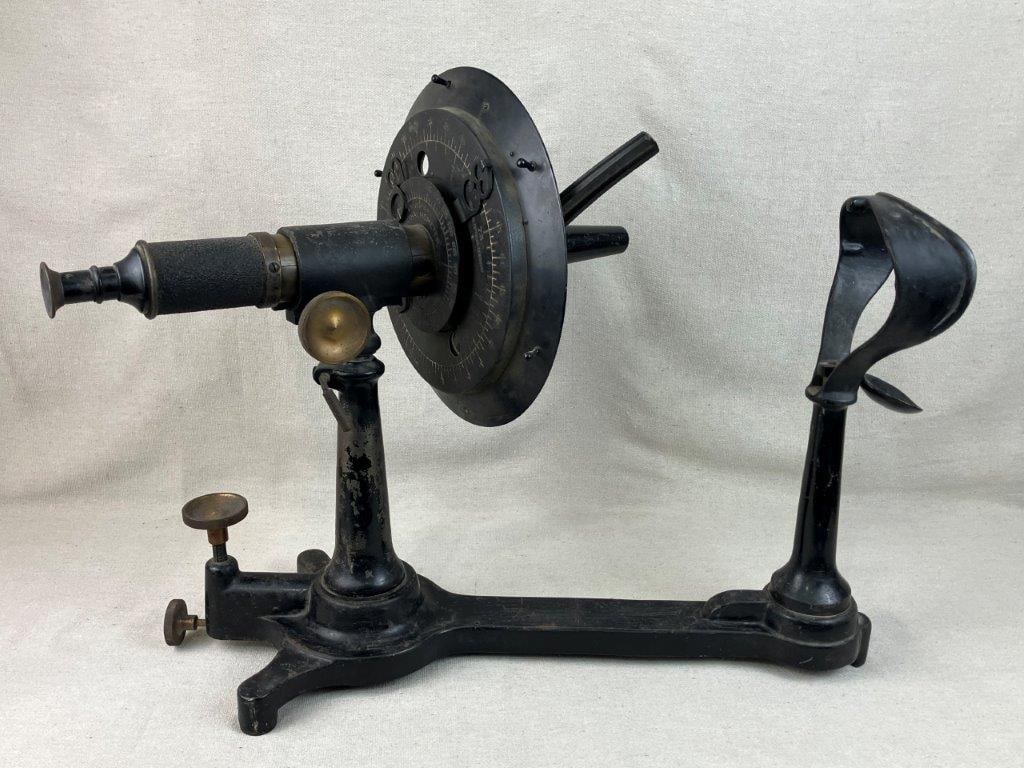 Early 20th Century Universal Ophthalmometer: This fascinating piece of medical history features a heavy cast iron form finished in classic black, standing as a striking example of early 20th-century scientific instrumentation. Originally