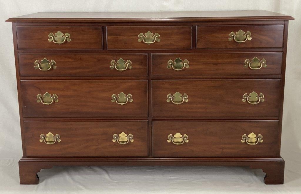 Henkel Harris Chippendale Nine Drawer Chest: A Henkel Harris American Chippendale nine drawer chest in a three over six configuration, constructed of solid black cherry with fine brass hardware and resting on bracket feet. It measures approximat