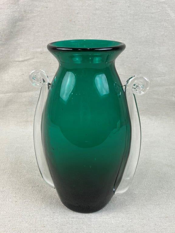 Blenko Glass Millennium Series Vase: This exceptional emerald green glass vase is from the Blenko Glass Millennium Series, designed by Matt Carter to celebrate the turn of the century. Showcasing a mid-century modern aesthetic, the
