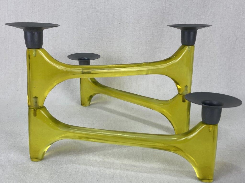 Mid-Century Modern Modular Candelabra: A vintage mid-century modern modular candelabra with two joints, constructed of yellow transparent molded resin with dark gray metal insert cups. Folded up the candelabra measures approximately 7 1/4
