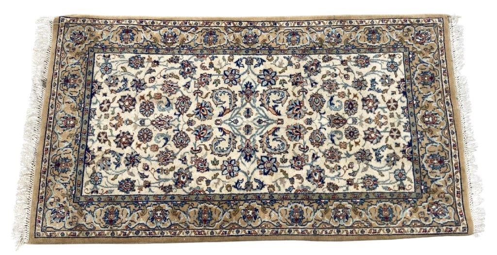 Hand-knotted Persian Rug: This hand-knotted Persian rug features a cream field adorned with an intricate, all-over floral vine layout of tiny rosettes, palmettes, and scrolling arabesques. The palette includes navy blue,