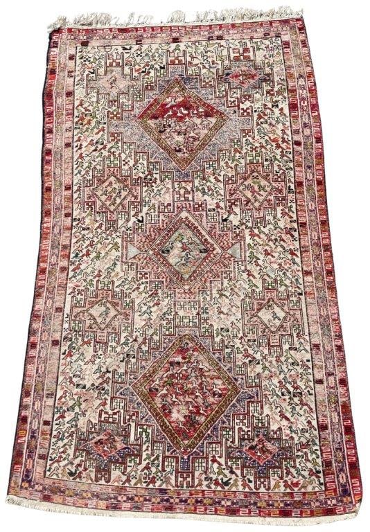 Handmade Soumak Persian Kilim Rug: A handmade Soumak Persian kilim rug with stunning colors featuring multiple animal motifs framed by geometric shapes. It measures approximately 84 inches x 46Â¾ inches. Some fading to the