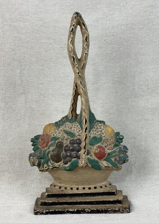 Antique Fruit Basket Doorstop: A figural antique fruit basket doorstop with rope handle, featuring wonderful original paint. It measures approximately 13 inches high x 7 inches wide x 1Â½ inches deep. In good condition