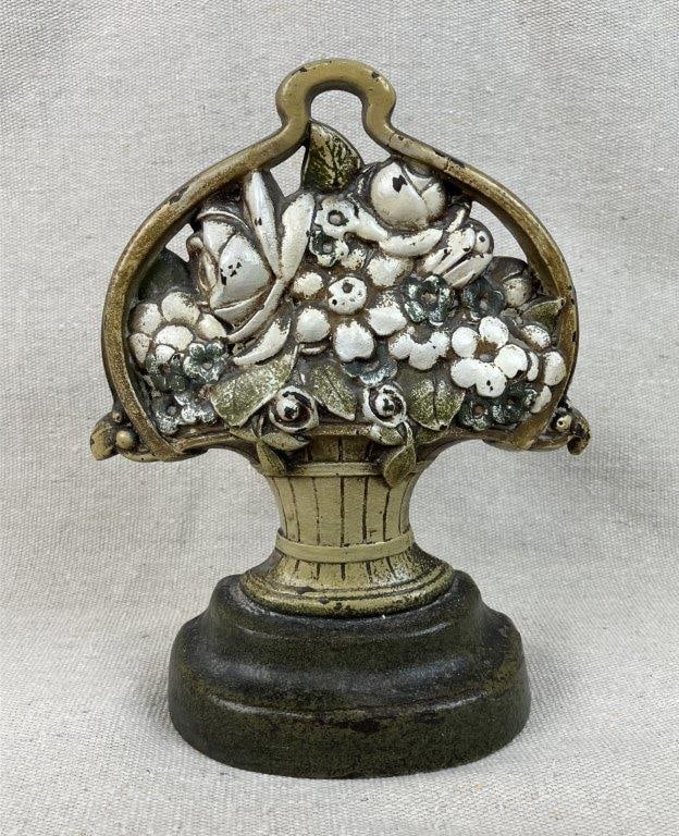 Antique Flower Basket Doorstop: An antique flower basket doorstop with aged patina and retaining its original paint. It measures approximately 7â…œ inches high x 6 inches wide x 2Â¼ inches deep. In good