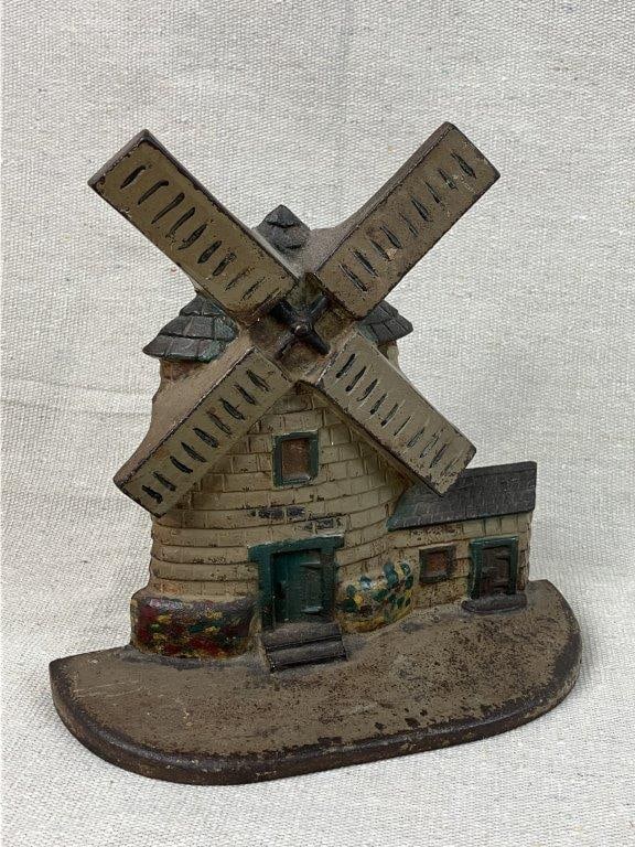 Cast Iron Windmill Doorstop: A cast iron windmill doorstop with wonderful original paint and floral decoration. It measures approximately 7 inches high x 7 inches wide x 2Â½ inches deep. In good condition with light los