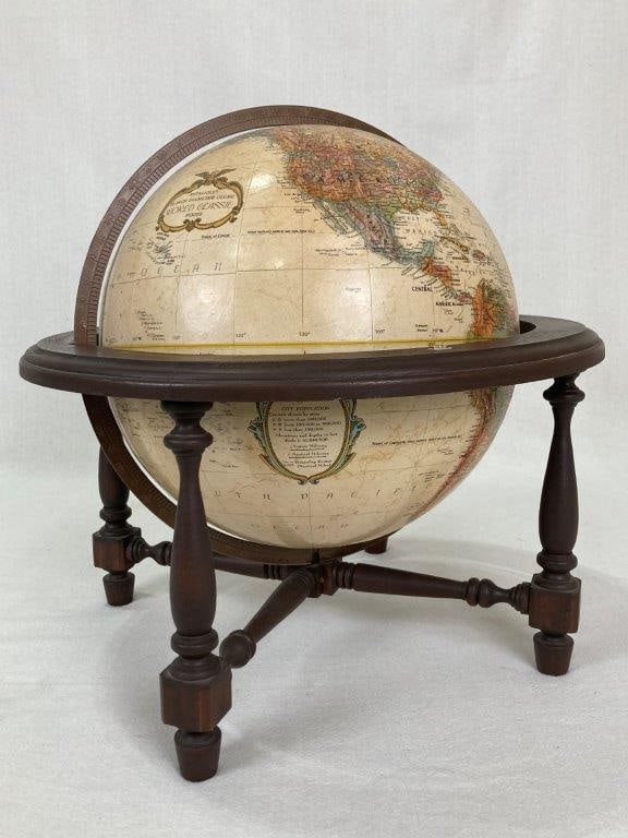 Vintage Replogle Globe: A vintage Replogle globe with a nice wood base by cartographer Leroy M. Tolman. It measures approximately 16Â½ inches high x 16 inches in diameter. In good condition.