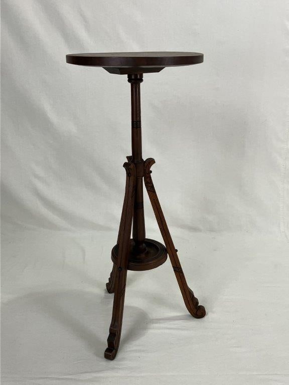Eastlake Mahogany Stand: A fine Eastlake mahogany stand featuring a circular top resting on a turned central post terminating in a tripod base with shaped legs. The piece displays excellent proportions and characteristic