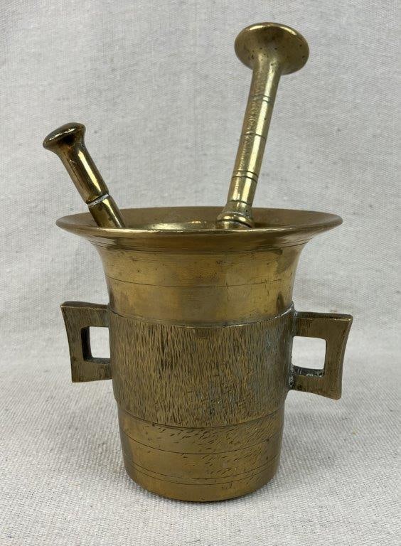 Brass Mortar and Pestle: This elegant brass mortar and pestle is crafted in the traditional Swedish taste, featuring a classic and stately two-handled form that beautifully blends historic utilitarian charm with