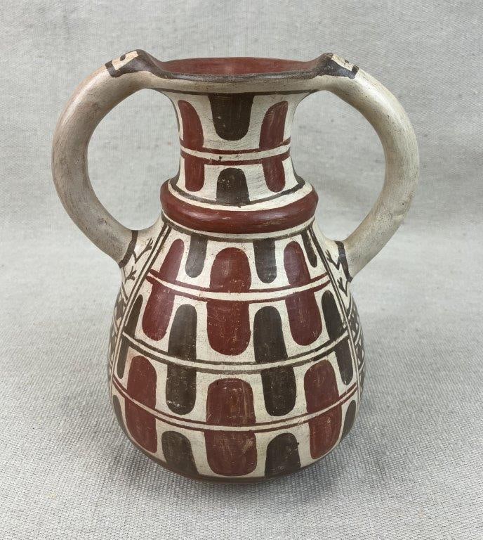 Chilean Hand-Painted Terracotta Studio Pottery Vase: This striking terracotta studio pottery vase from Chile features a beautifully hand-painted native motif executed in an intricate geometric design. Created by the artisan Millar (also known as P.