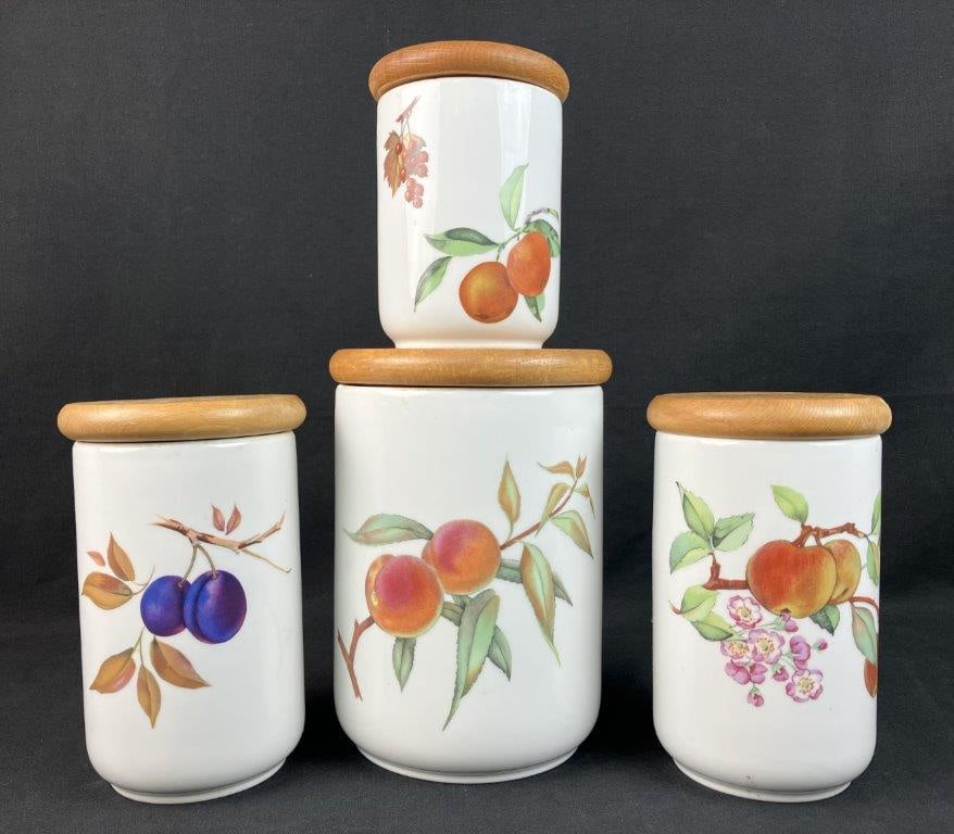 Royal Worcester Porcelain Evesham Storage Jars: Four-piece collection of fine English porcelain by Royal Worcester features the maker's classic, fruit-themed "Evesham" pattern across four storage canisters or jars, each fitted with a complementary