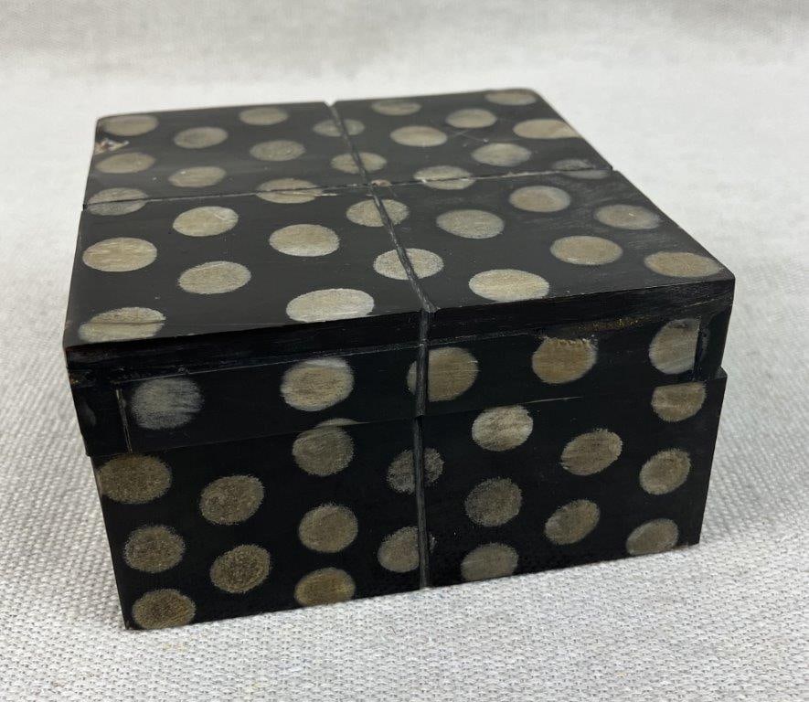 Polka Dot Black Lacquer Box: This stylish decorative box features a rich black lacquer finish accented by a playful polka dot design. Combining a sleek, polished aesthetic with a classic pattern. The box measures approximately 2
