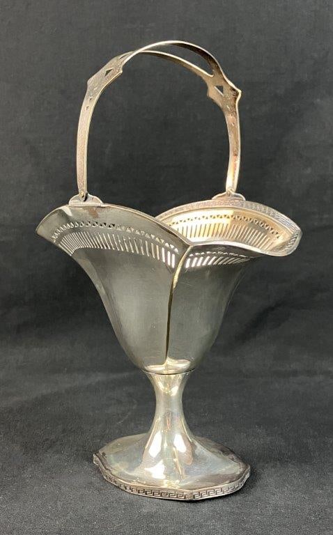 Simeon L. & George H. Rogers Company Silver Plate Sugar Basket: This classic silver-plated sugar basket by the Simeon L. & George H. Rogers Company features a stately pedestal base supporting a distinctive flared bowl. The piece is adorned with an engraved Greek