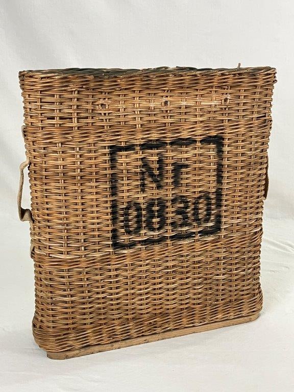 WW2 European Artillery Shell Wicker Basket: This woven wicker basket was designed to hold separate metal ammunition canisters or shell tubes during World War II. Typically associated with German or Swiss military forces from the late 1930s to