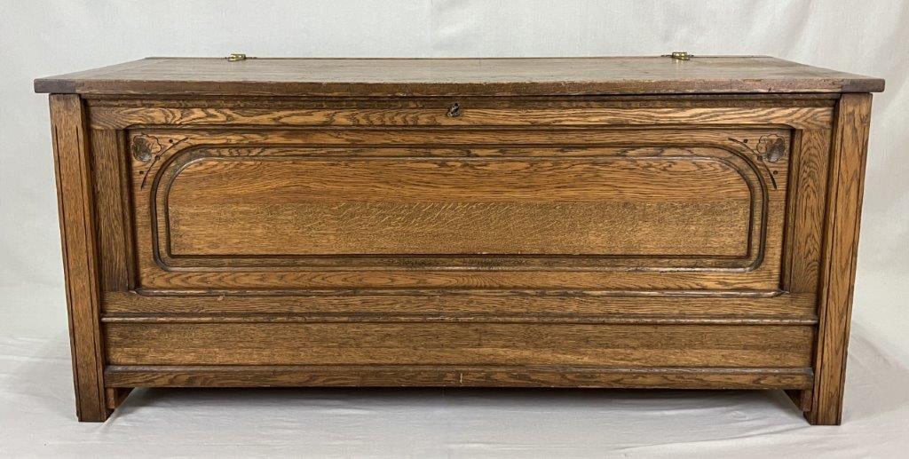 Fine Oak Blanket Chest: A fine and large oak blanket chest featuring quartersawn oak with a handsome grain, ornate brass hinges, and paneled front and sides. The piece displays strong presence and excellent proportions typic