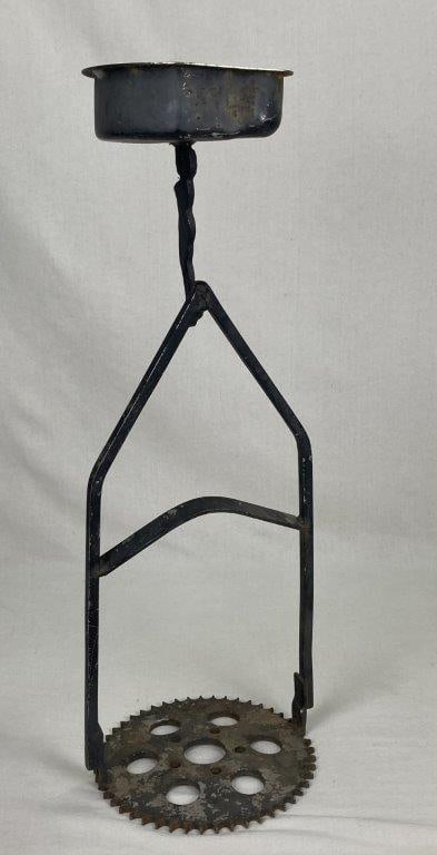 Folk Art Metal Plant Stand: A whimsical folk art metal plant stand featuring a charming and inventive design with a gear base. The piece displays creative handcrafted character typical of American folk metalwork with strong