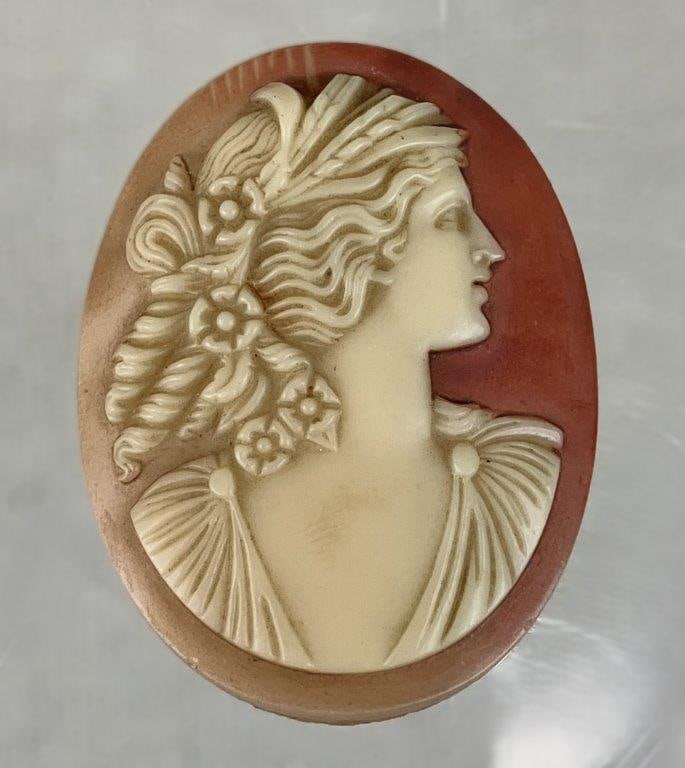 19th Century Shell Cameo: 19th-century Victorian cameo is meticulously hand-carved from a natural marine shell, showcasing the delicate tonal layering and romanticism iconic to the period's personal adornments. The central