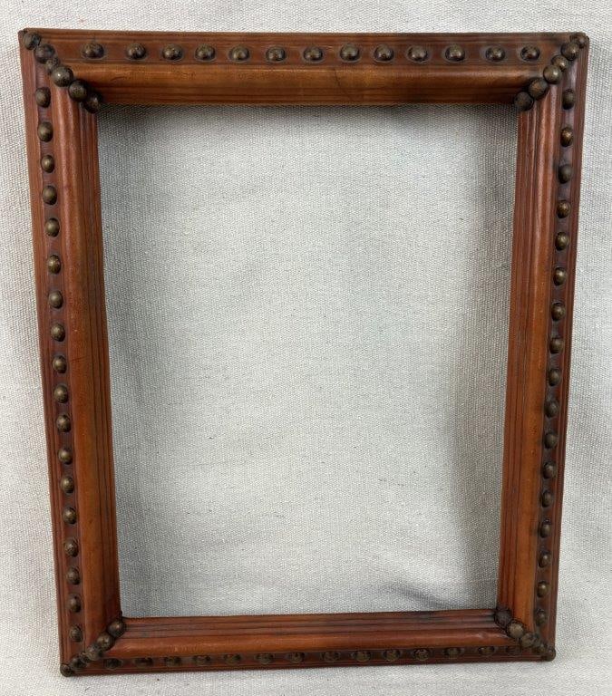 Studded Warm Leather Frame: Frame is enveloped in a rich leather covering that is meticulously embellished with a decorative border of metal tacks or studs, showcasing a wonderful example of historic Western-inspired