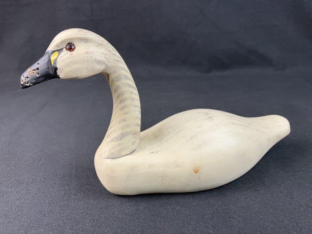 Swan Decoy: Small-scale swan decoy beautifully captures the serene elegance and graceful lines of classic American waterfowl carving. Exhibiting meticulous craftsmanship, the decoy features a hand-painted finish