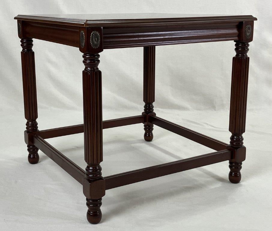 Contemporary Mahogany Table: Mahogany table combines timeless elegance with refined craftsmanship, featuring a perfectly balanced square silhouette supported by intricately turned and reeded legs. Thoughtfully decorated with