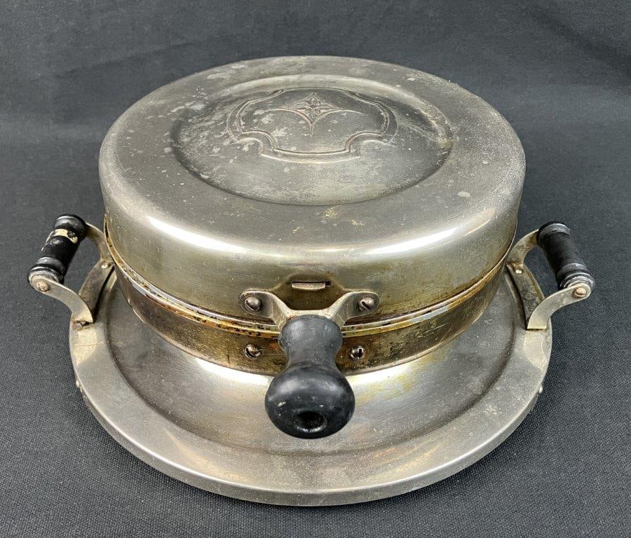 Art Deco Waffle Iron by Landers, Frary, & Clark: Early 20th-century kitchen Americana showcases the sleek, machine-age aesthetic of the Art Deco era, produced under the Reliance line by the legendary manufacturing giant Landers, Frary, & Clark of