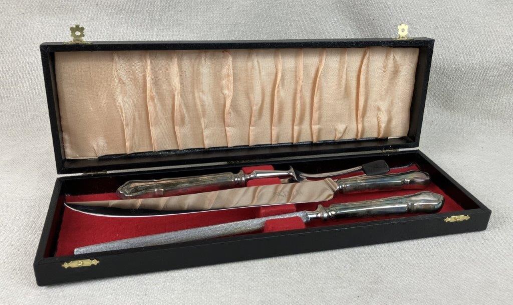 Sheffield Carving Set: Elegant carving set from Sheffield, England, features a high-quality stainless steel carving knife, a carving fork, and a matching sharpening steel, all beautifully outfitted with sophisticated silver