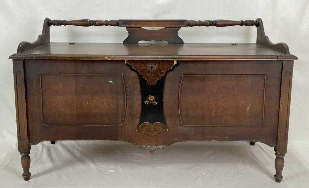 20th Century Mahogany Blanket Chest: A 20th century mahogany blanket chest resting on turned legs. It measures approximately 30 inches high x 50 inches wide x 22 inches deep. Some wear to the finish consistent with age.