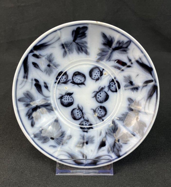 Flow Mulberry Strawberry Cup Plate: Showcases a beautiful example of historic flow mulberry or black, featuring a highly collectible and vibrant strawberry motif. The delicate design depicts trailing strawberry vines, blossoms, and