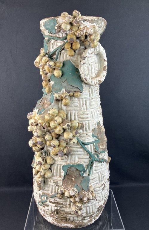 Italianate Style Sculptural Vase Lawn Ornament: An elegant Italianate style vase lawn ornament featuring a highly detailed, sculptural grape and vine motif gracefully draped across a classic basketweave patterned body. The classical design adds a