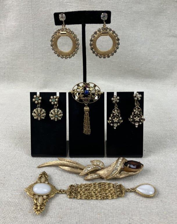 Vintage Jewelry Assortment Including Renaissance Revival: Group of six pieces features three elegant brooches and three pairs of earrings, highlighted by a beautiful Renaissance Revival brooch. This central piece boasts a moonstone-style stone at its