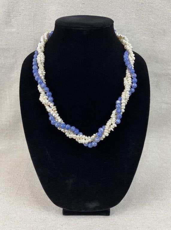 Faux Pearl Multi-Strand Necklace: Features a rich, multi-strand design that artfully weaves lustrous faux pearls with faux blue stone beads, skillfully crafted to mimic the appearance of lapis lazuli. The intricate composition is