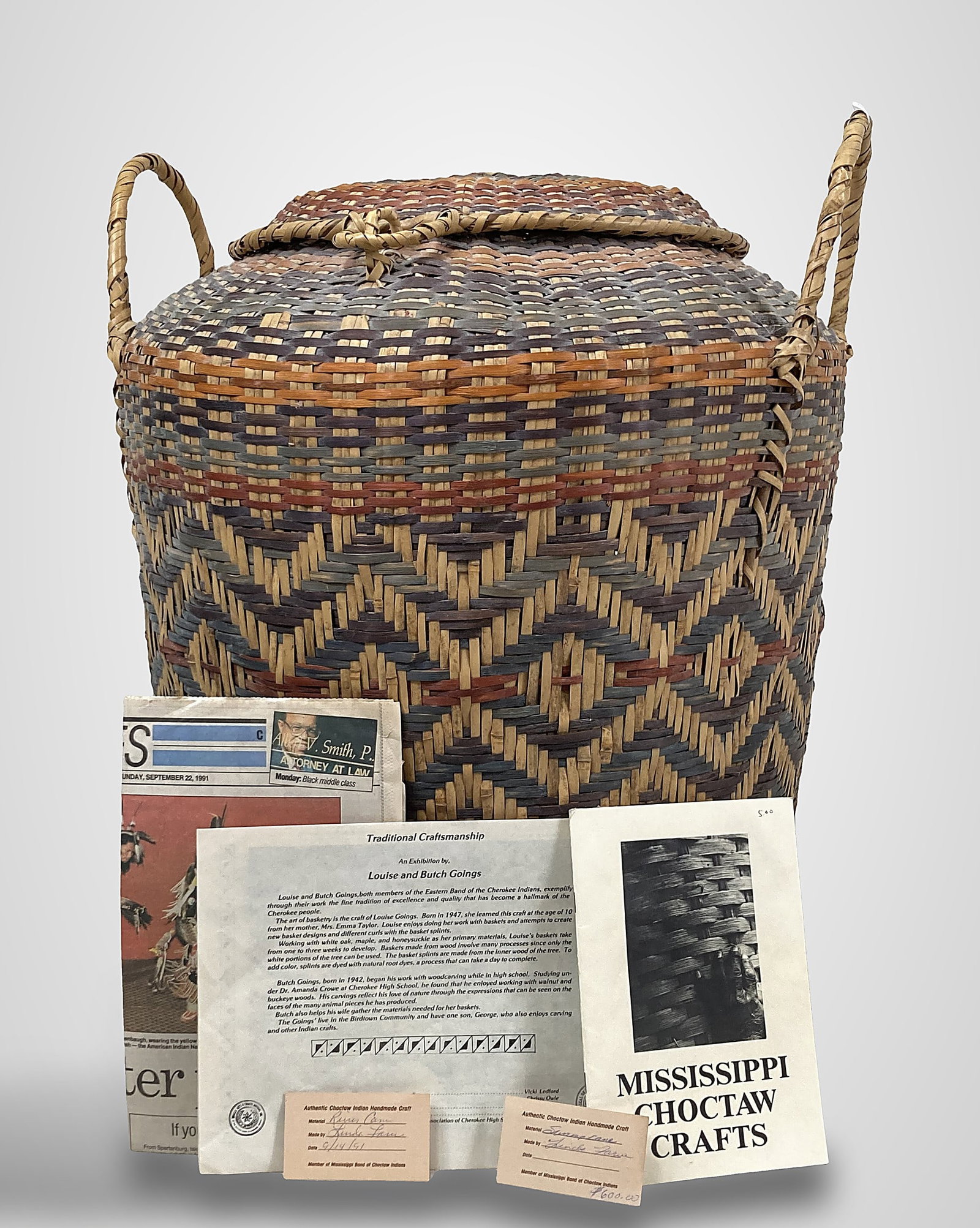 Large Choctaw Indian Linda Farve Lidded Basket: This massive lidded basket, featuring two handles, is vibrantly decorated with traditional geometric patterning. It is the work of Linda Farve, a renowned master weaver based in Philadelphia,