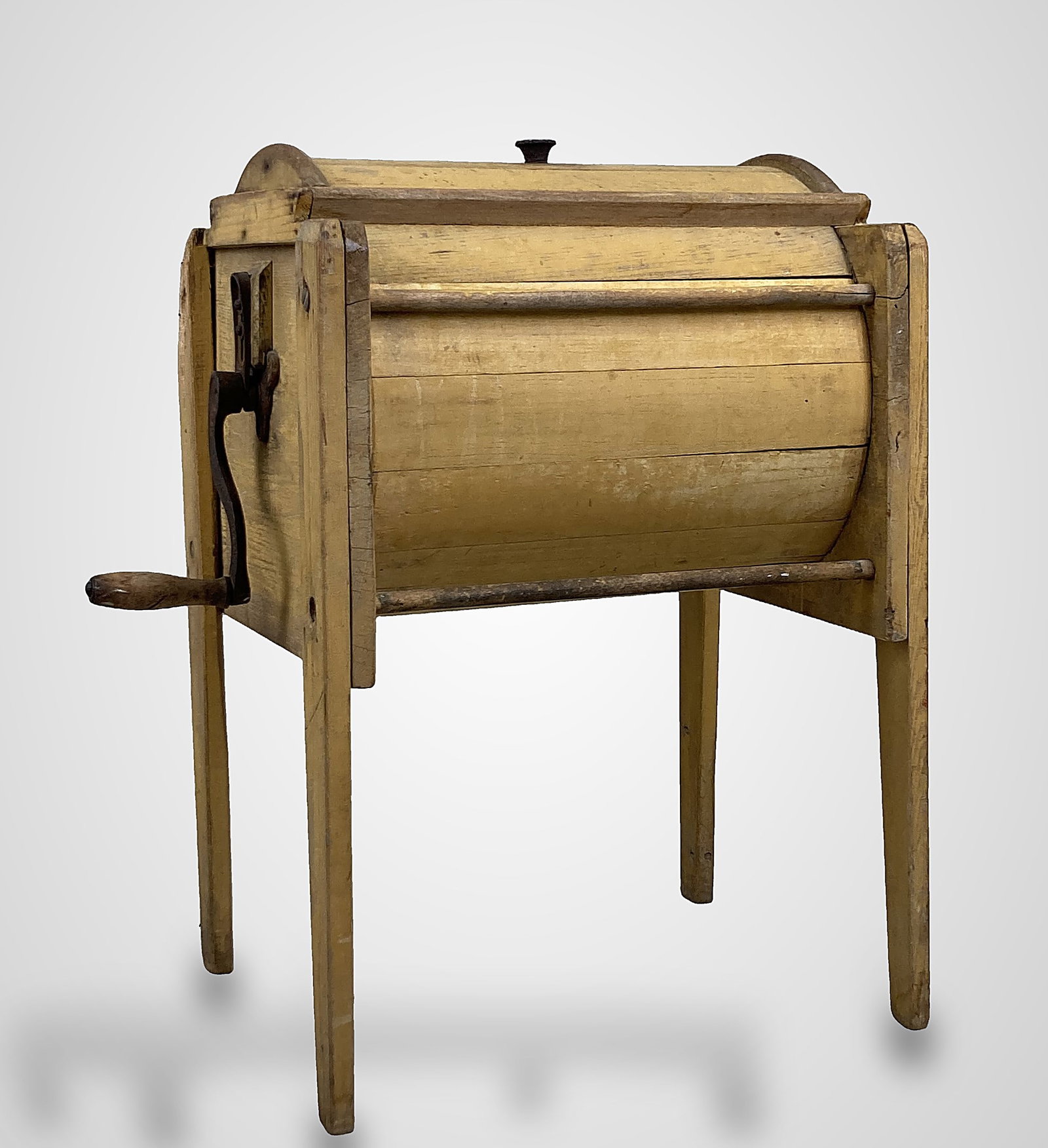 Blanchard & Sons Stencilled 12 Gallon Churn: A charming Blanchard & Sons 12 gallon butter churn, retaining its original yellow painted surface with black stencilled maker's decoration, fitted with an iron hand crank; 33 in. high, 27Â½