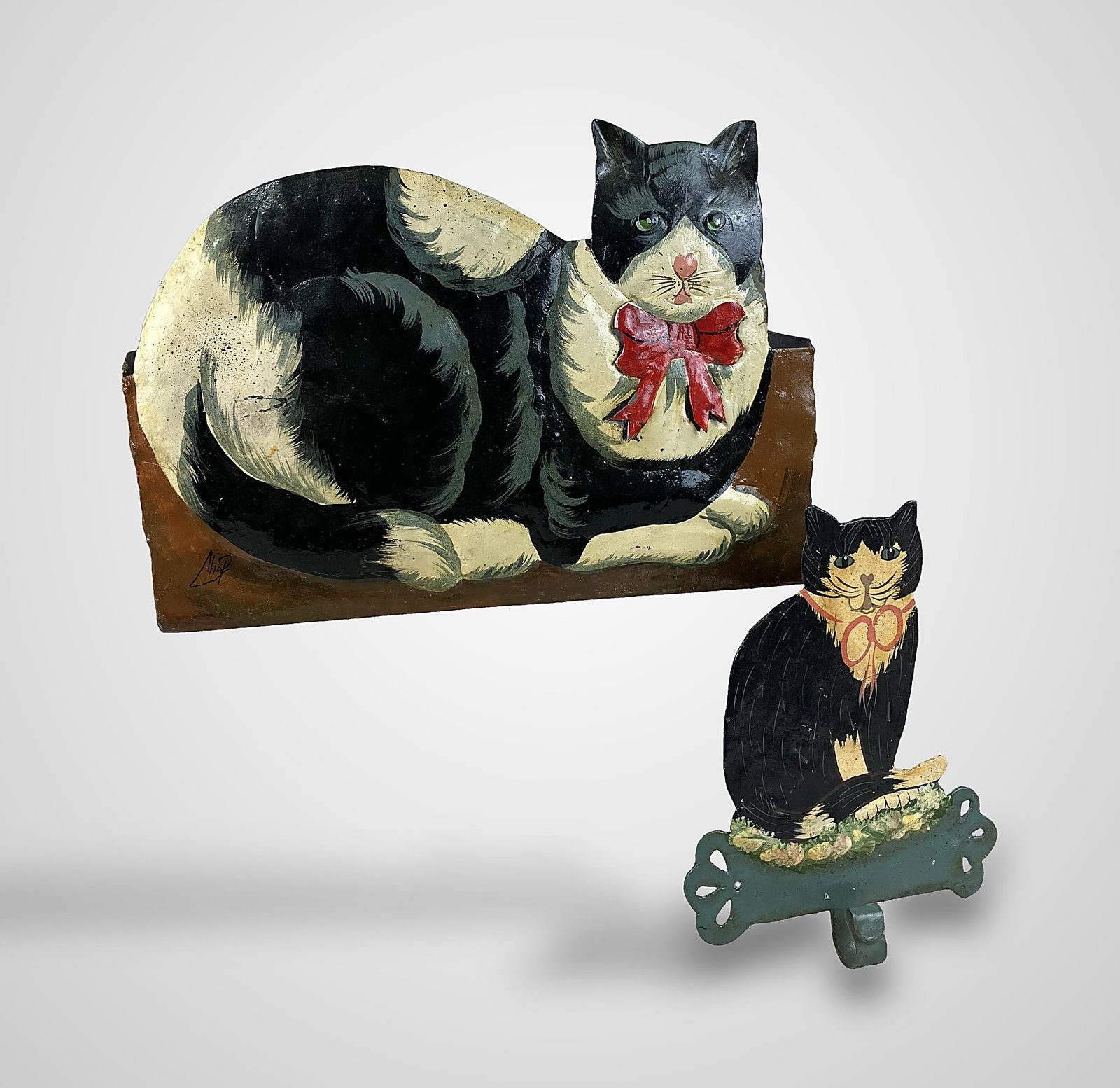 Folk Art Polychromed Cat Tin Storage Box and Key Hook: Includes a wall-mounted storage box and a key hook, both embellished with charming, hand-painted cat depictions that showcase folk artistry. The storage box measures approximately 8 1/2 in. H x 11
