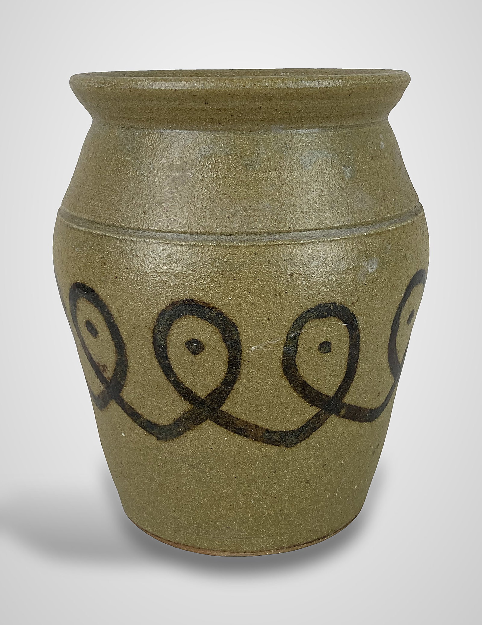 Gary Dexter Salt Glaze Pottery Jar: This salt-glazed pottery jar was made by South Carolina potter Gary Dexter. It features iron slip decoration consisting of a looping line below a tooled shoulder line and is signed "Dexter" on the