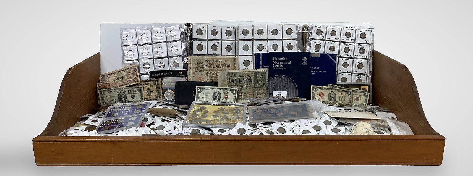 Lot of Assorted Vintage Coins and Bills: This extensive collection includes a variety of vintage currency, highlighted by a 10,000 Mark Reichsbanknote issued by Germany on January 19, 1922, a Series 1928F United States $2 Legal Tender Note, 