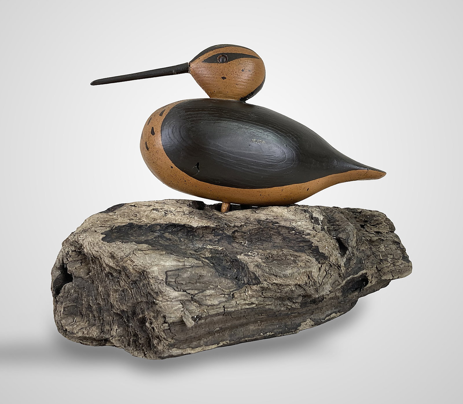 Signed Polychromed Folk Art Shorebird Sculpture: This hand-carved and hand-painted shorebird sculpture features a smooth, rounded body decorated with contrasting black and ochre/orange tones. Notable details include fine speckling on the breast, a d