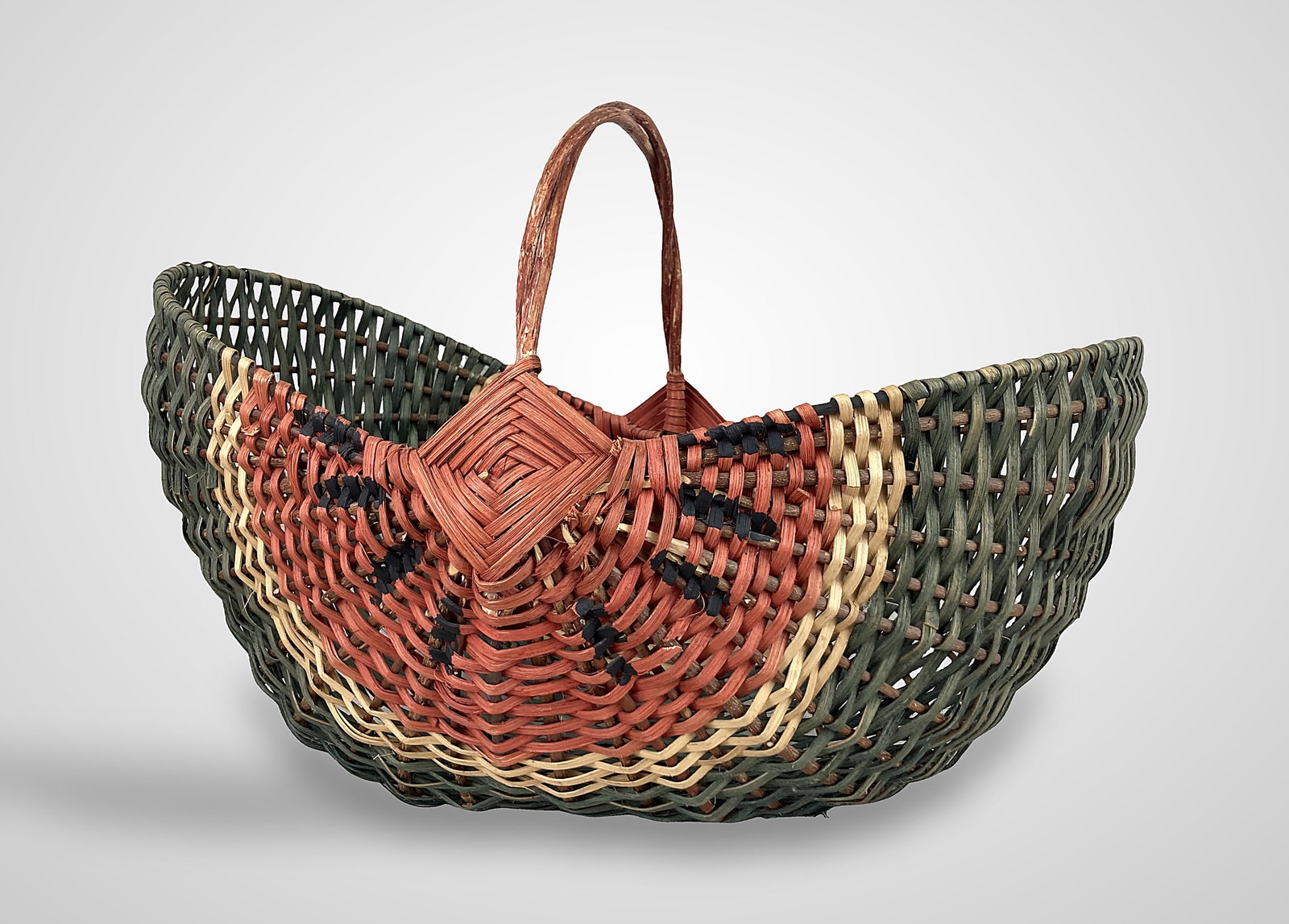 Large Painted Country Watermelon Basket: This large split oak basket features a "God's eye" pattern on both sides and a twisted, red-dyed handle. The body is expertly dyed in shades of green, red, and black to mimic the appearance of a water